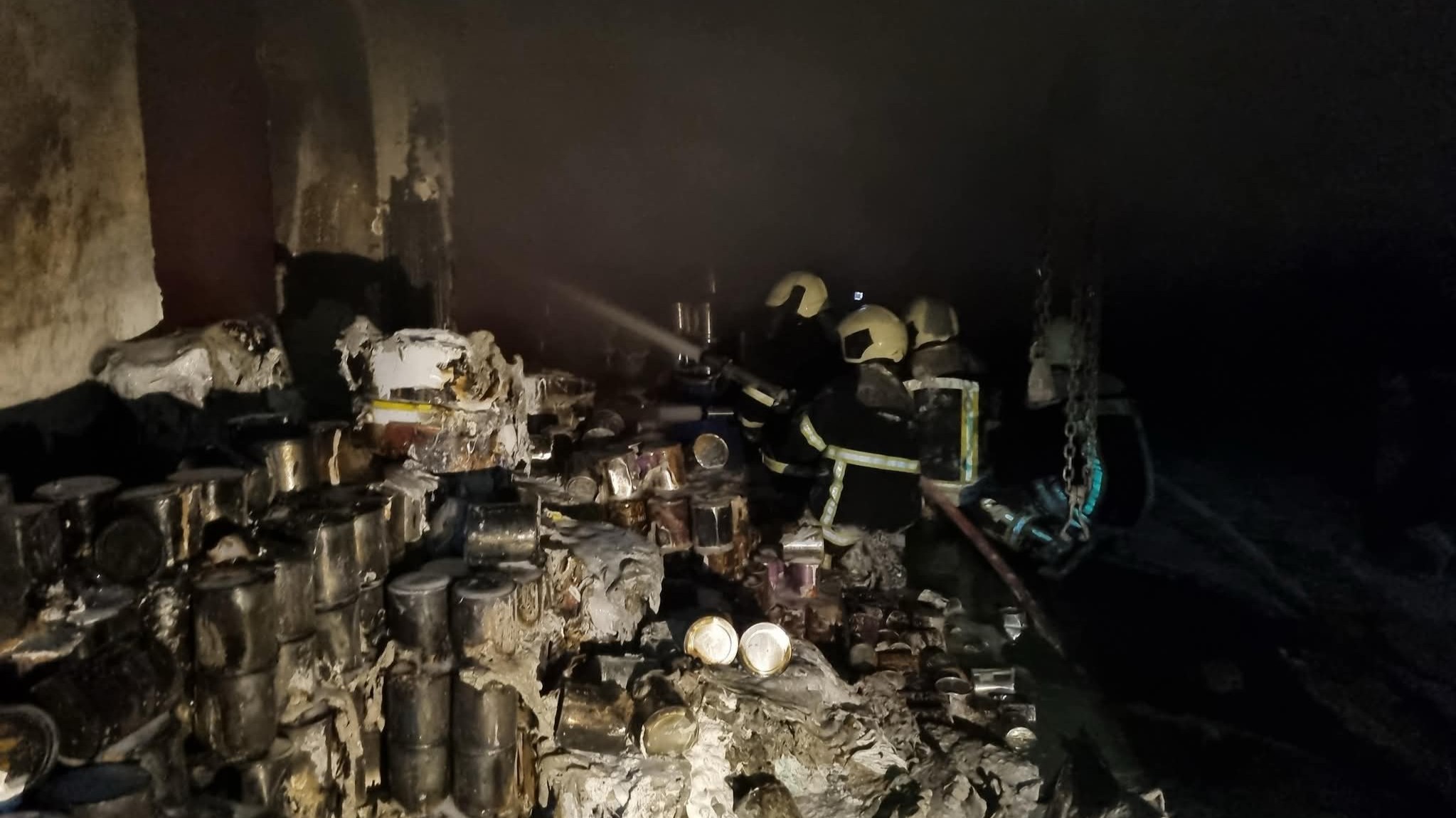 A fire devours a paint factory and fire crews are in a race against time