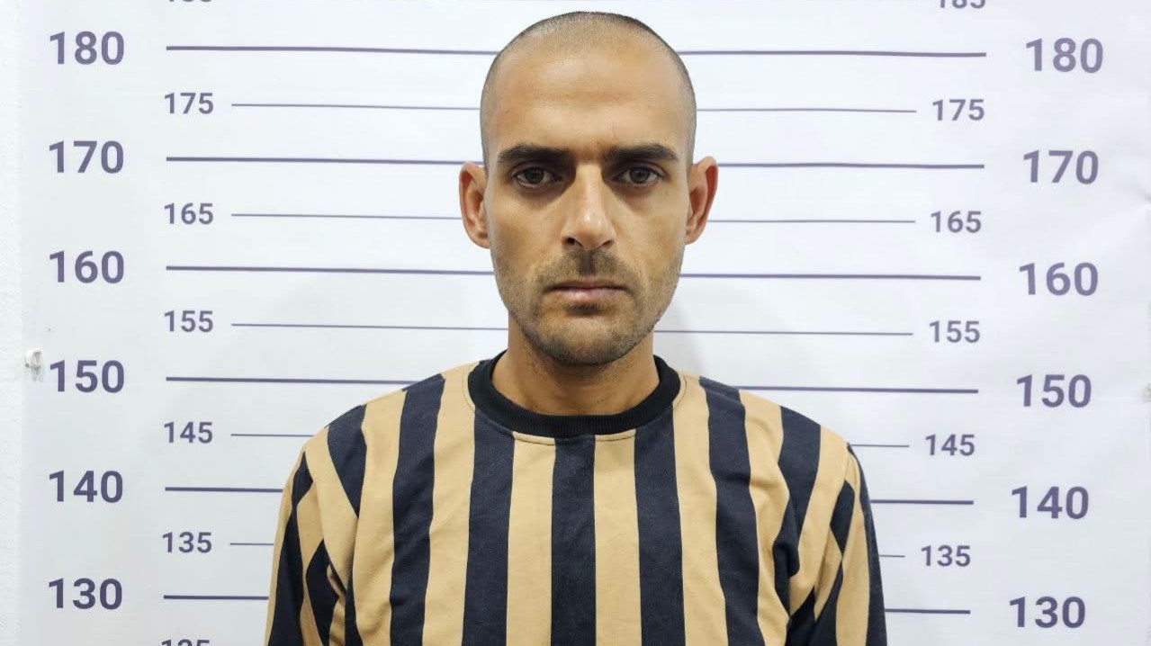 The arrest of a prisoner in Saydnaya prison in Aleppo on charges of torture and summary executions