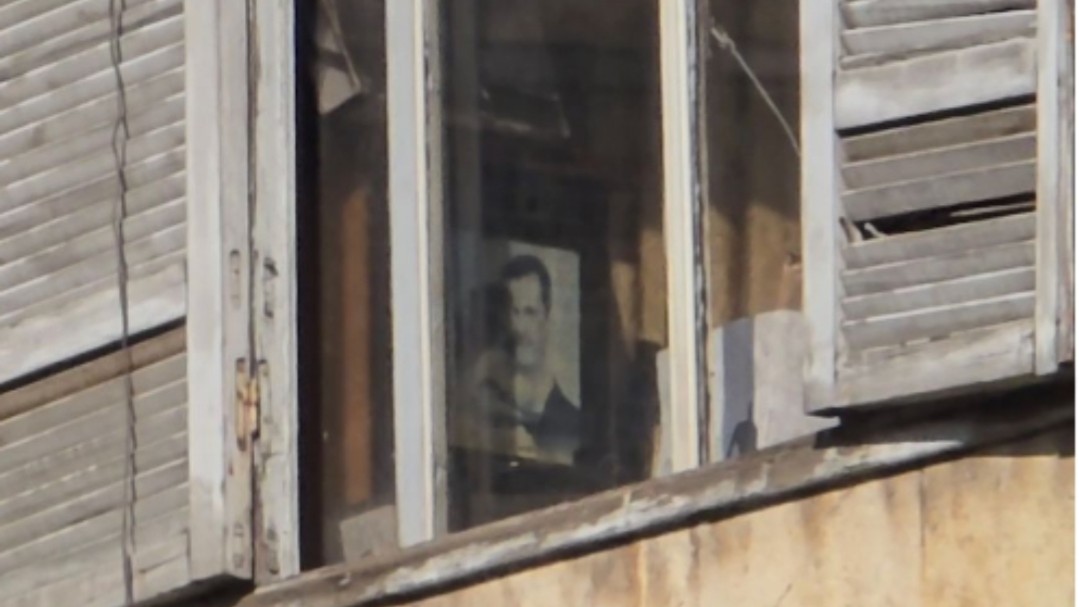 A picture of Assad inside the Aleppo education building sparks controversy during a demonstration for teachers
