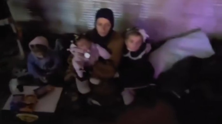 Three children sleep under the sky after being evicted from their home in Aleppo