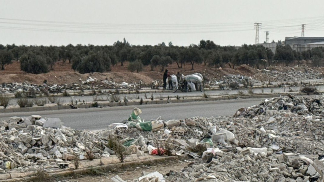 The dumping of rubble on Sixty Street in Homs threatens the documentation of mass graves