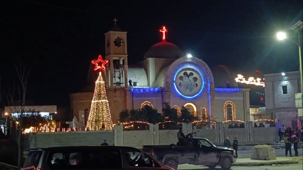 Lighting the Christmas tree in Al-Qusayr after an attempt to start a fire near it