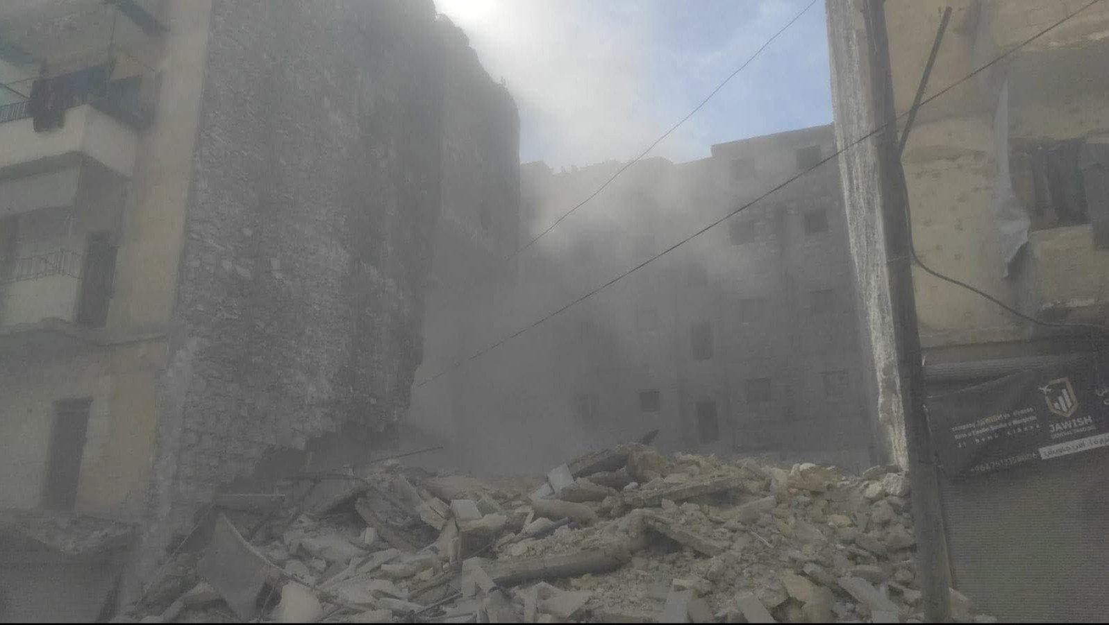 3 families are trapped under the rubble when a building collapsed in the Ashrafiya neighborhood in Aleppo
