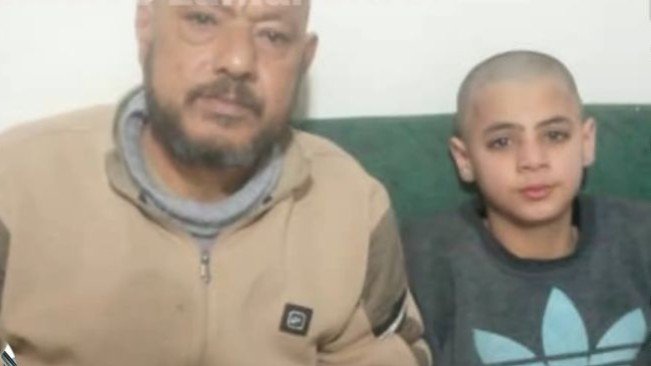 A child is detained and has his hair shaved inside a prison in Idlib.